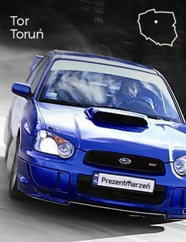 jadące niebieskie subaru